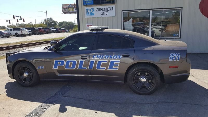 Police cruiser with decals on the side.