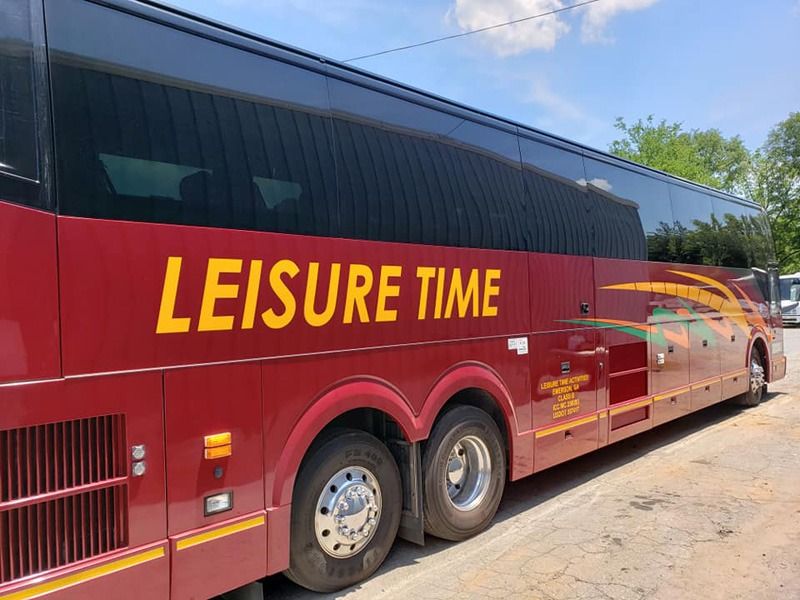 Decals printed on the side of a red RV.