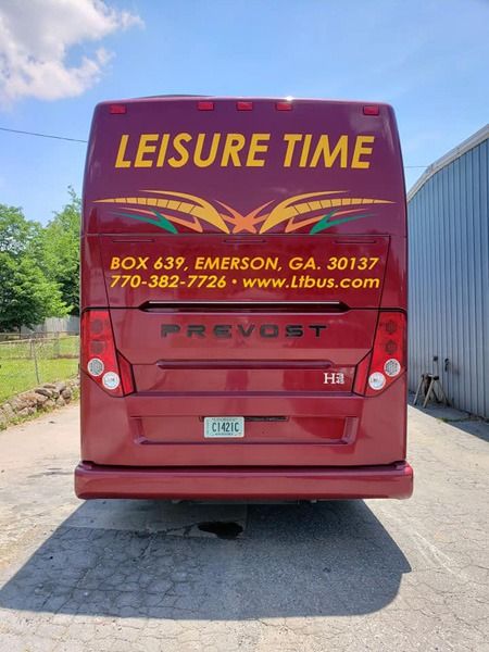 Decals printed on the rear of a red RV.