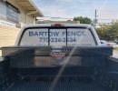 Perforated print on a rear window of a truck.