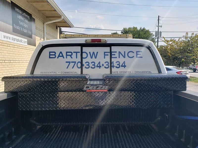 Perforated print on a rear window of a truck.