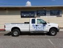 Decals on the side of a white truck.