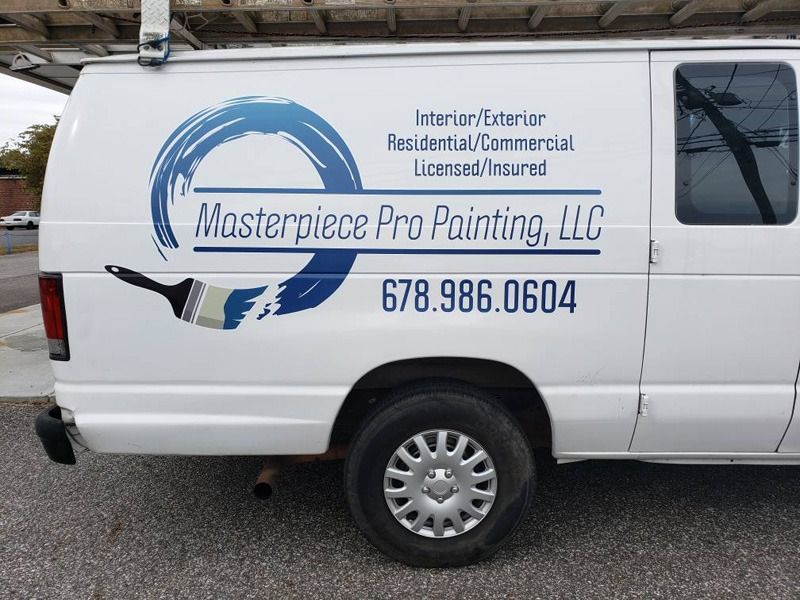 Vehicle decals on the side of a white van.