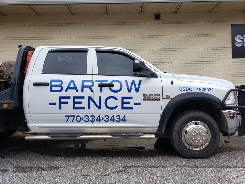 Decals on the side of a work truck.