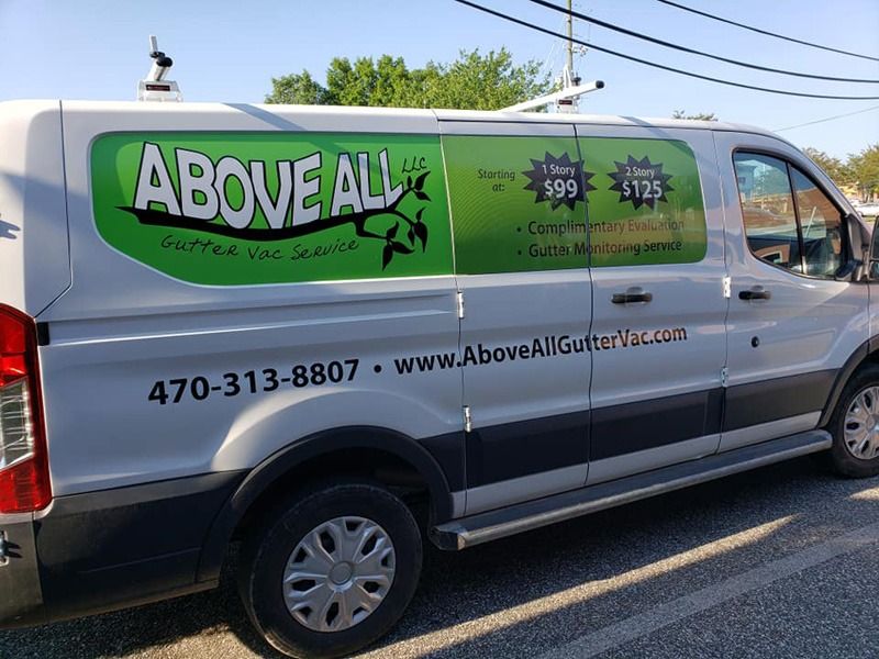 Perforated print on the side of a company van.