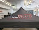 Portable tent with company branding.