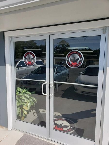 Vinyl decals on the window of a business's door.