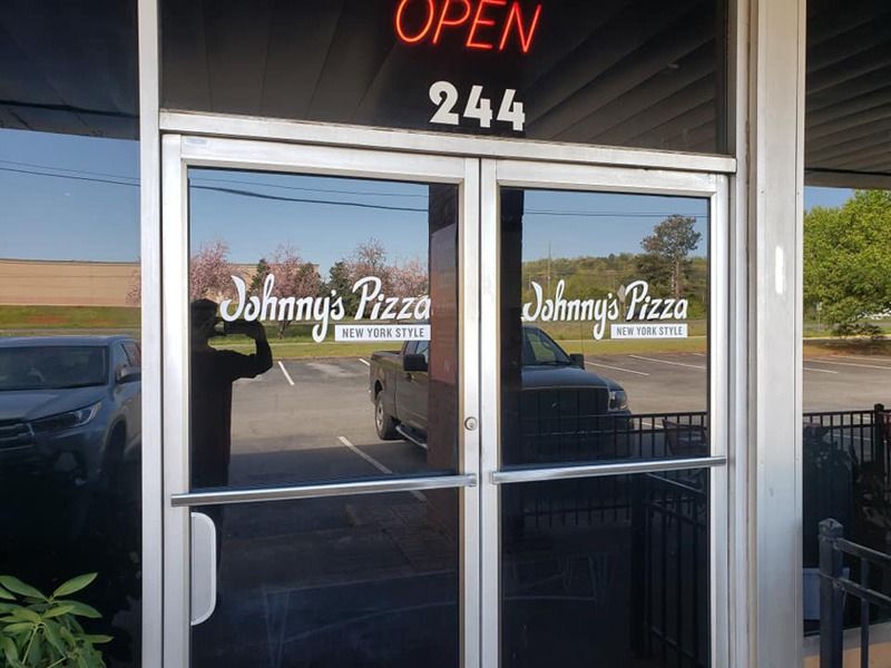 Glass door decals for Johnny's Pizza.