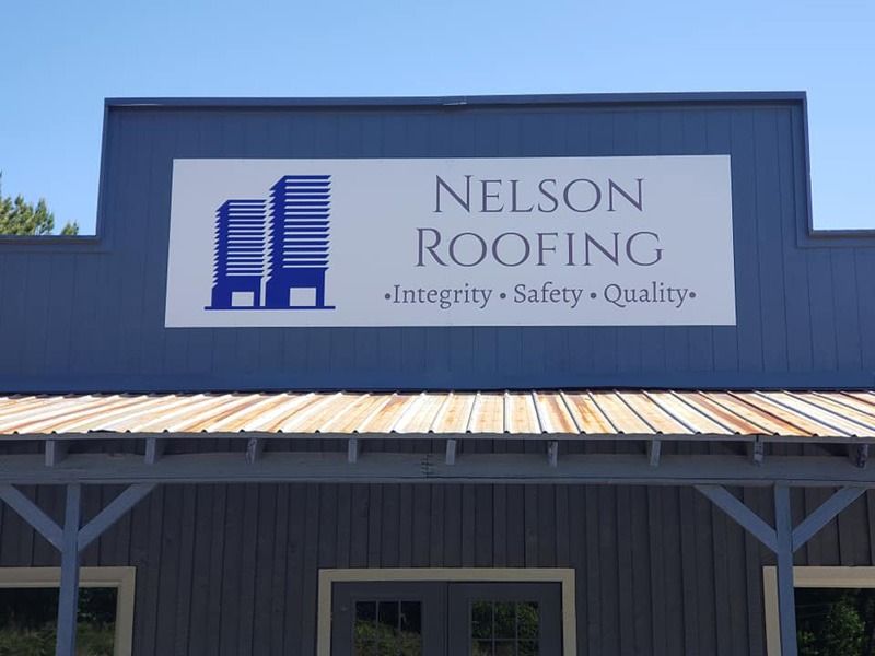 Overhead sign for a roofing company.